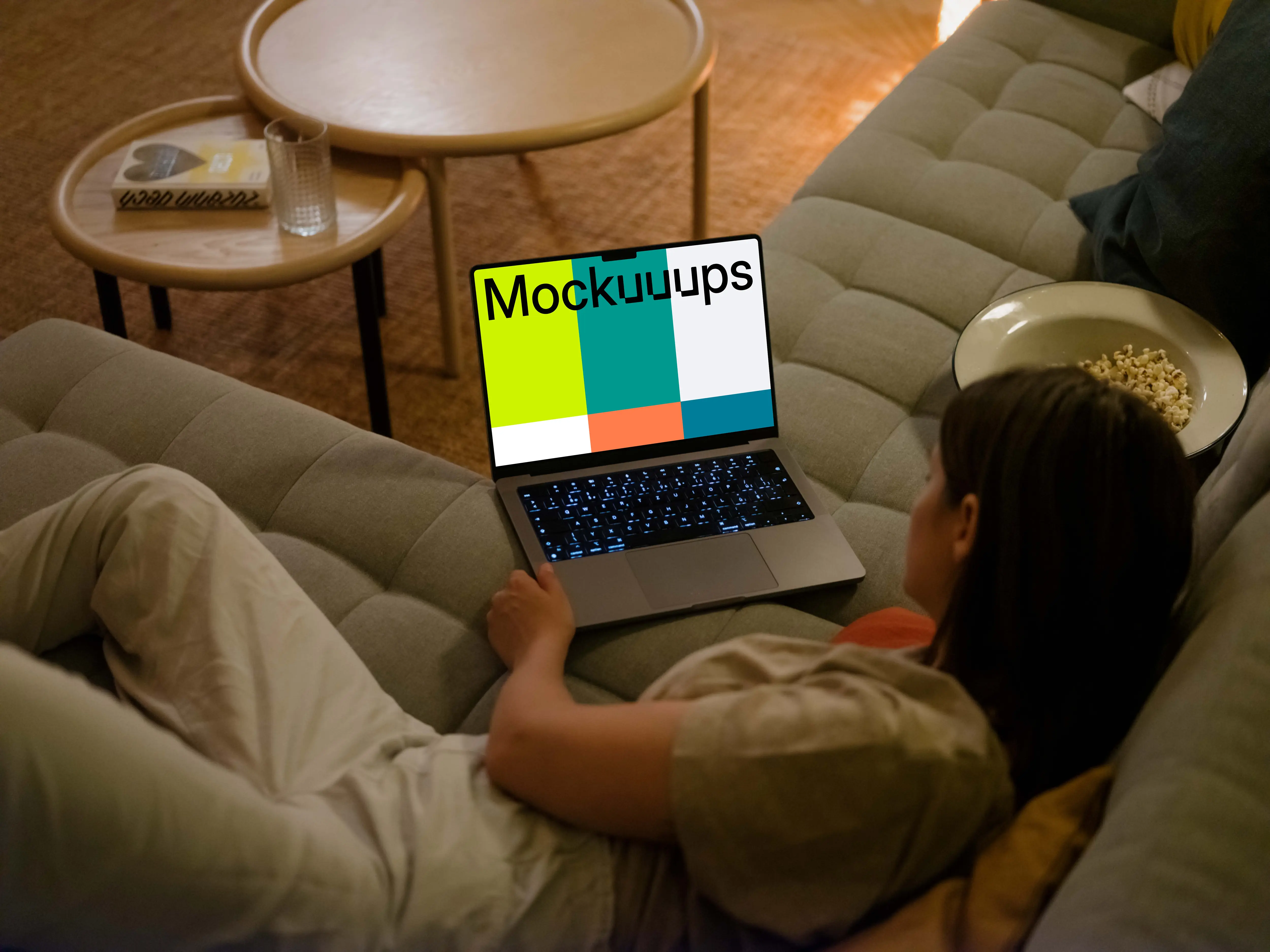 Woman looking at MacBook Pro mockup