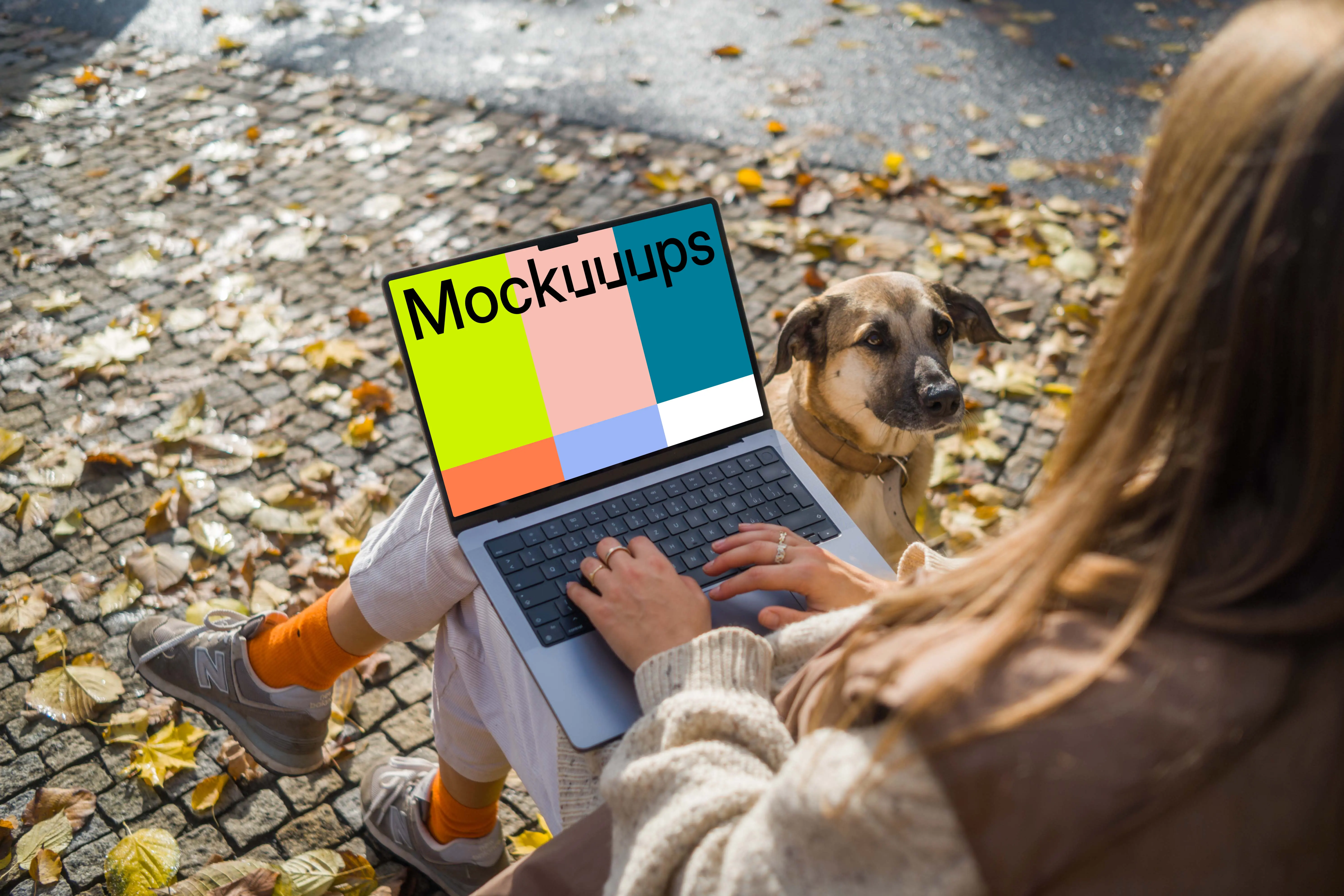 Woman sitting next to the dog with a MacBook Pro 14 mockup