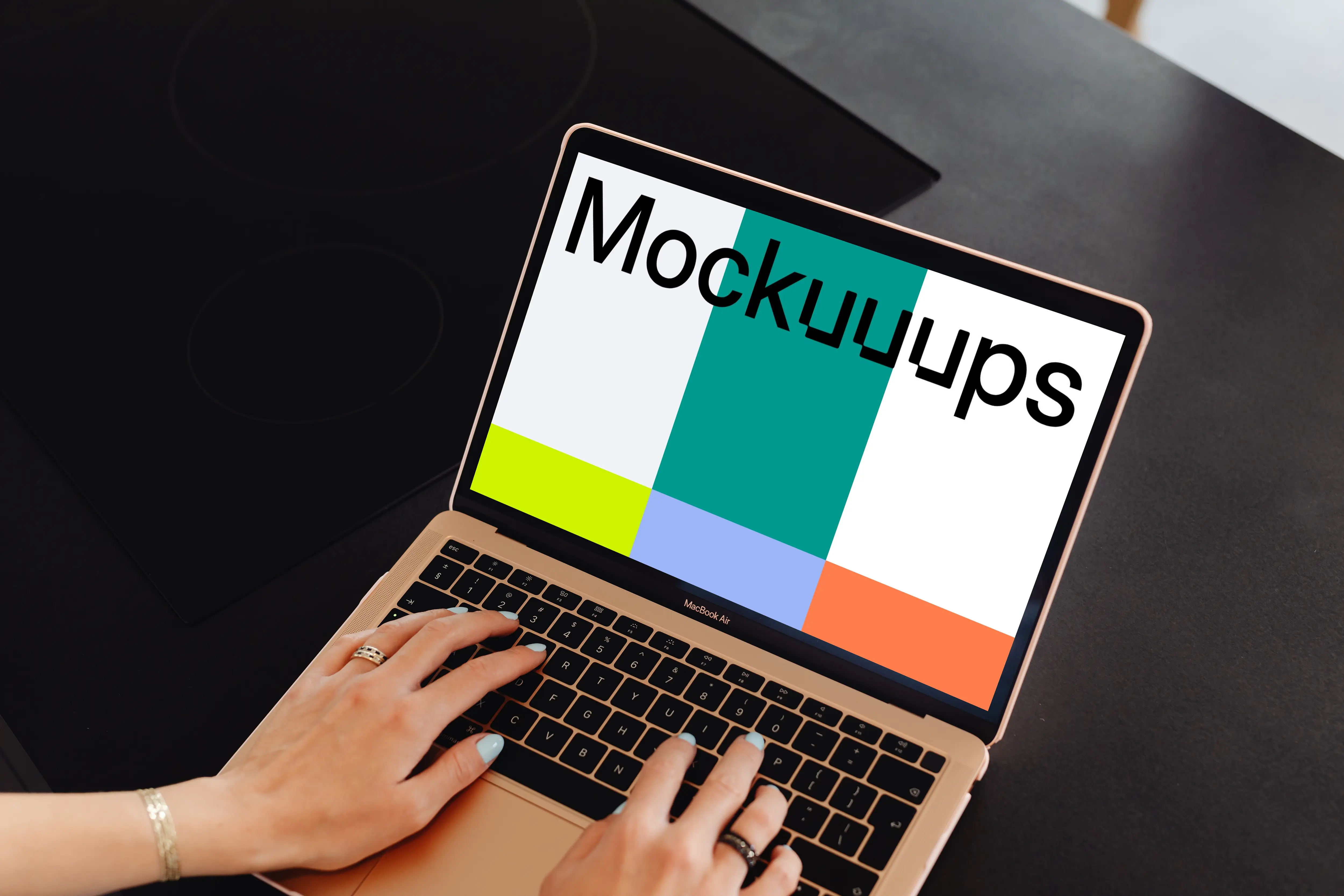 Woman typing a MacBook Air mockup