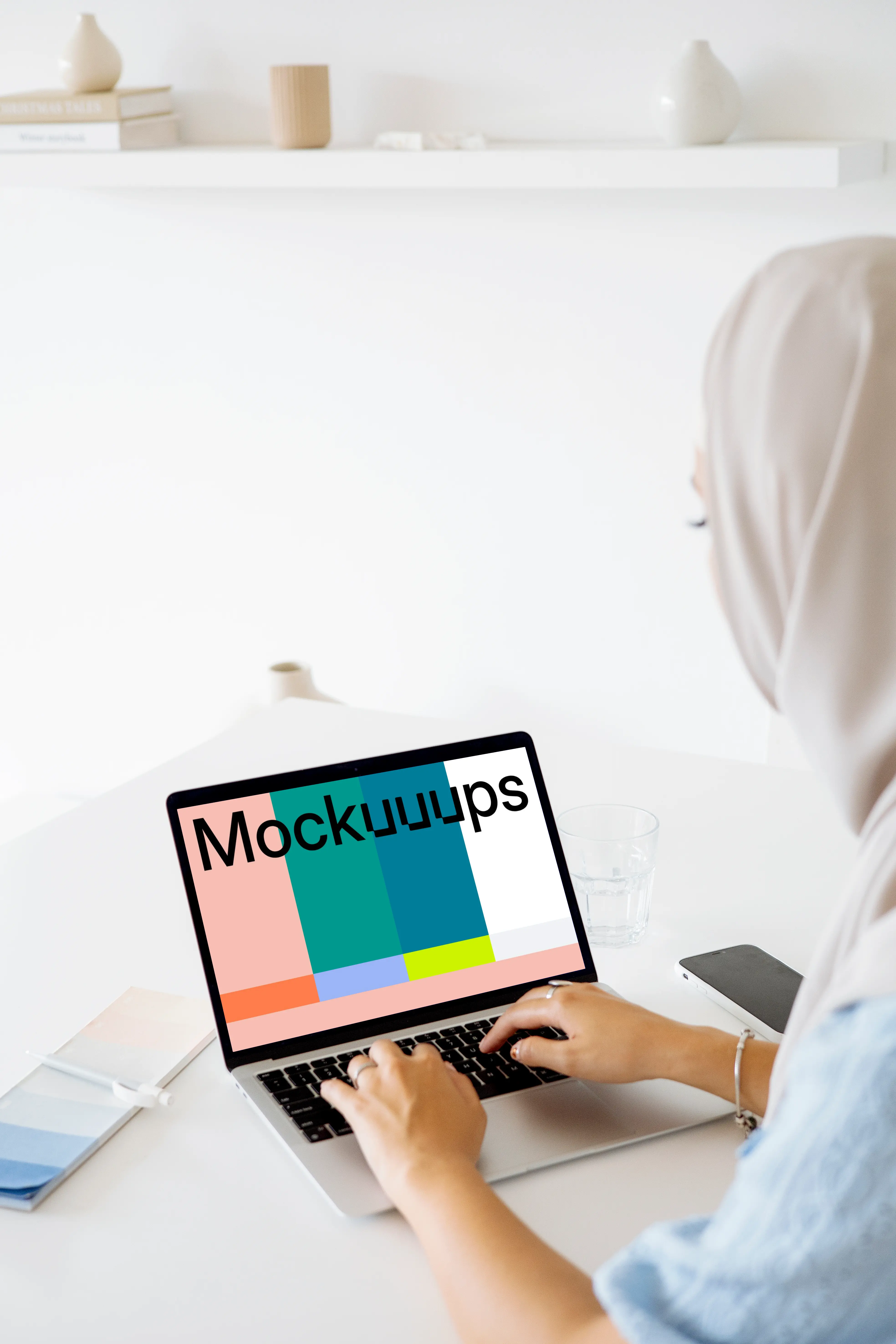 Woman typing on a MacBook Pro mockup