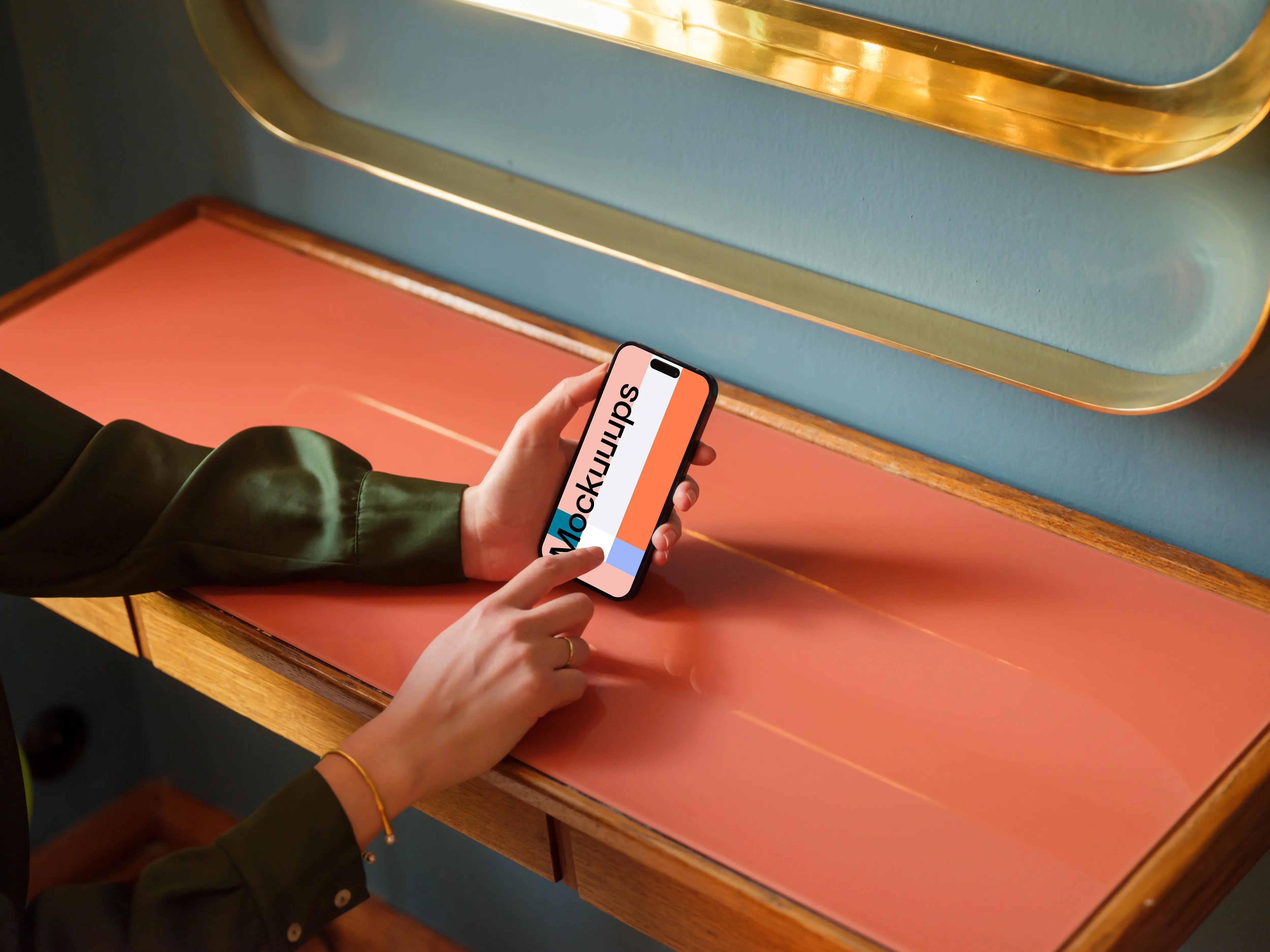 Woman typing on a phone in the lounge