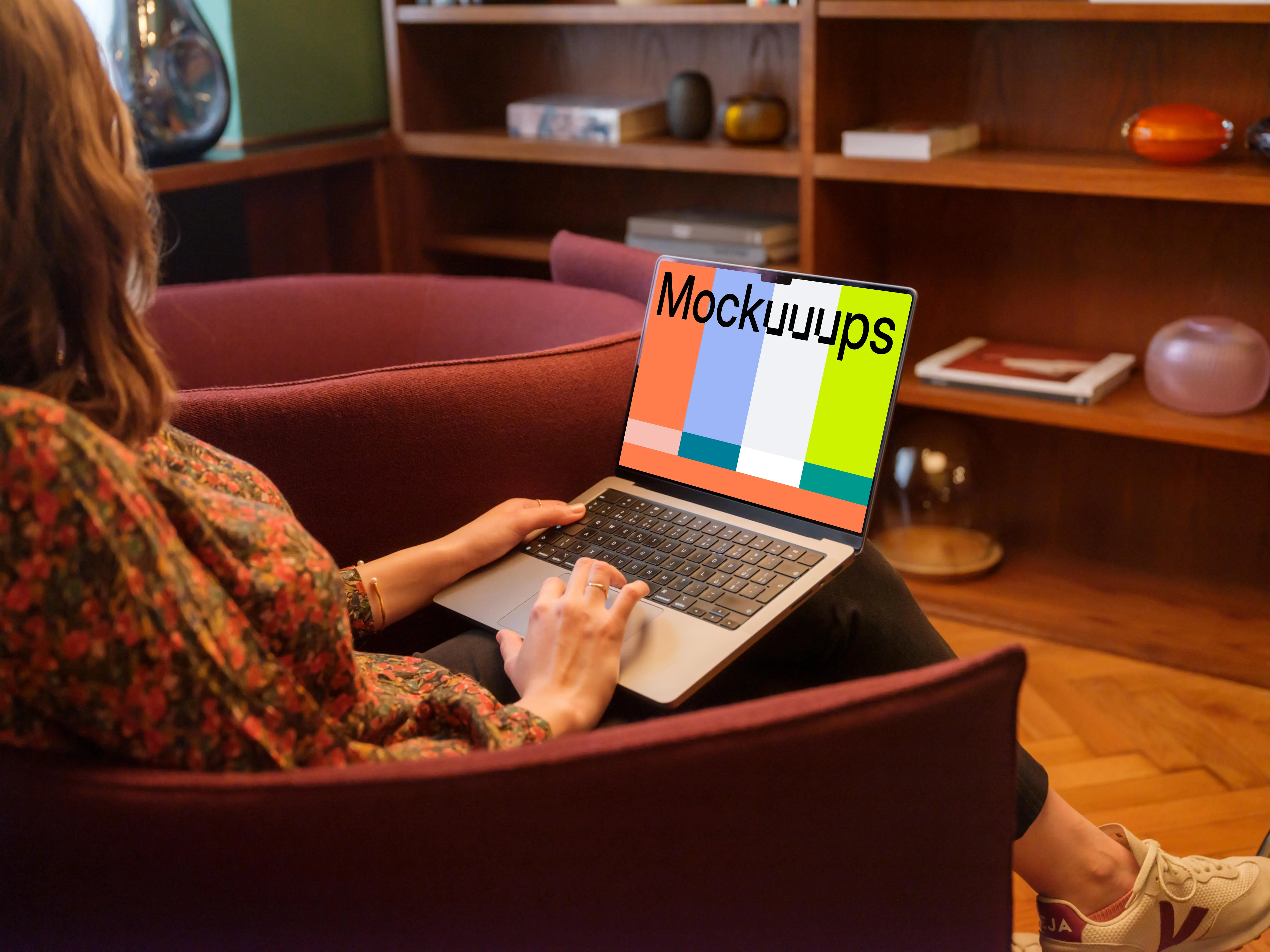 Woman working on the MacBook Pro mockup in office environment