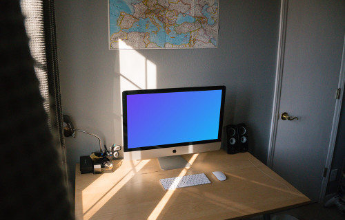 iMac mockup in a room on a table by the window