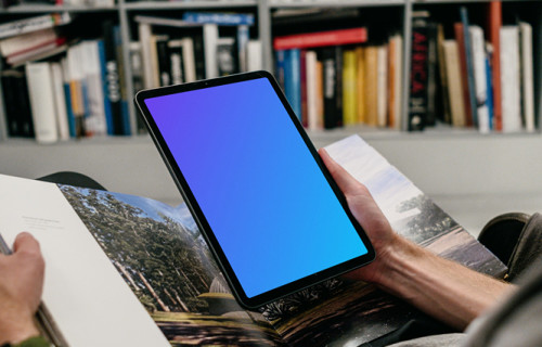 iPad Air mockup held by user in a library