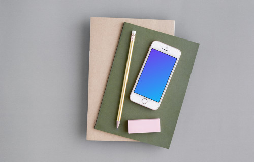iPhone SE mockup with a green and brown journal