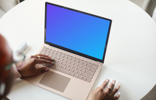 Laptop Mockup of a Young Woman Using a Surface Laptop
