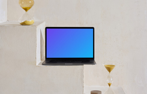 MacBook mockup on staircase with hourglass at the side