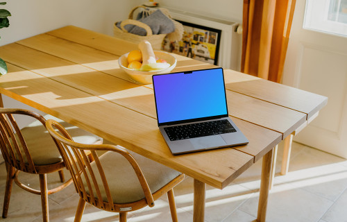 MacBook Pro mockup at dining table setup