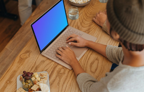 Microsoft Surface Laptop mockup with a platter of food at the side