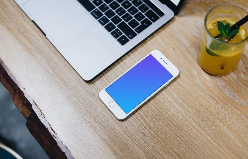 Silver iPhone 7 mockup on the wooden table