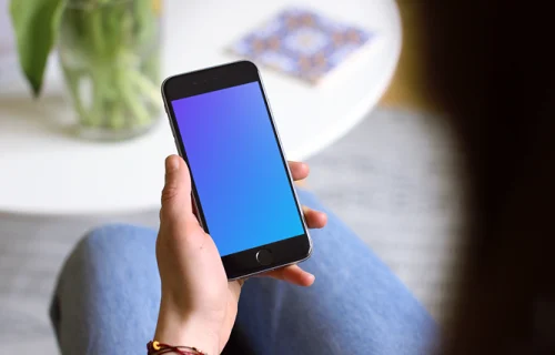 Sitting on the couch with iPhone 6s mockup