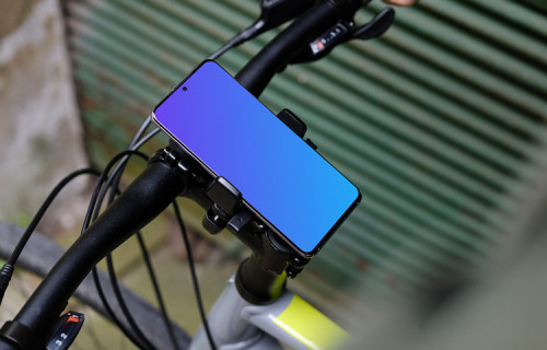 Bike next to a garage door with Samsung S20 mockup in bike mount