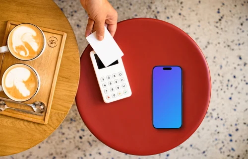 Coffee shop scene iPhone mockup with payment terminal