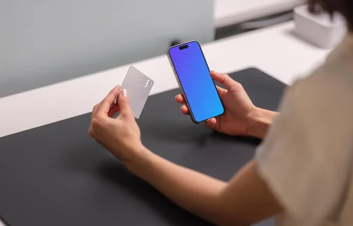 Free iPhone 15 Pro mockup with credit card in hand