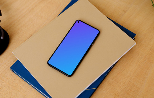 Google Pixel mockup stacked on a pair of notepads