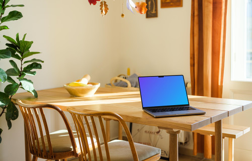 Grey MacBook Pro mockup on a dining table
