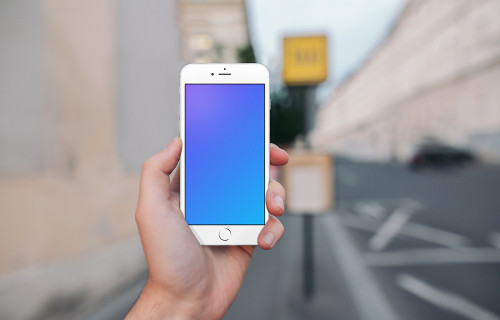 Holding iPhone 6s mockup in front of a Taxi Stand