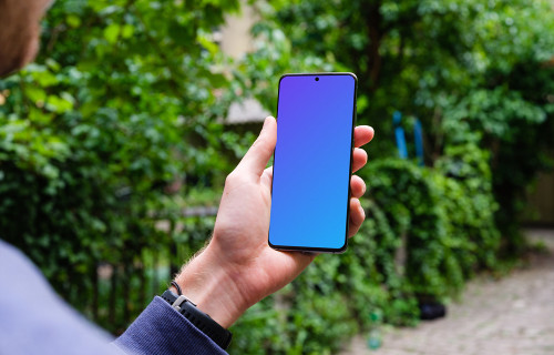 Holding Samsung Galaxy S20 mockup amongst trees