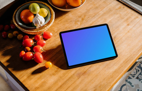 iPad Air mockup on a table beside some tomatoes