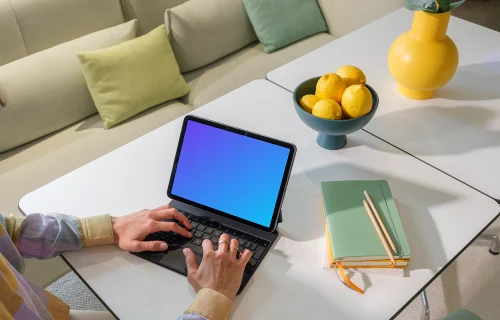 iPad Air mockup with woman's hands on home office desk