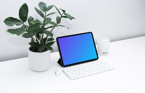 iPad mockup on a white table beside Airpods Pro