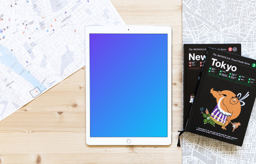 iPad Pro mockup next to the travel guides