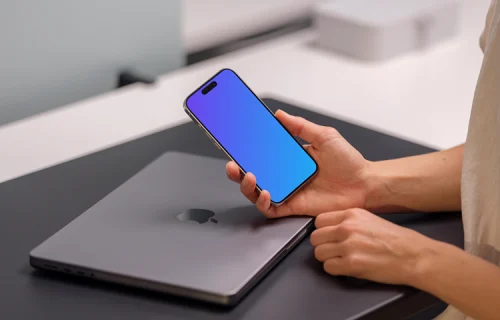 iPhone 15 Pro mockup with a professional workspace