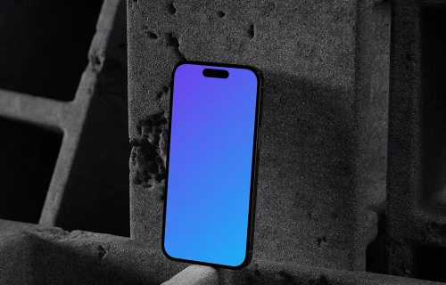 iPhone 16 mockup with concrete backdrop