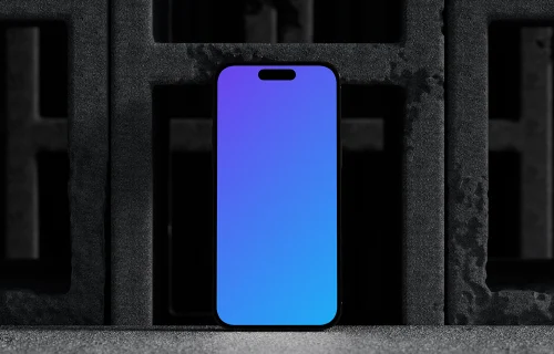 iPhone 16 mockup with concrete blocks backdrop