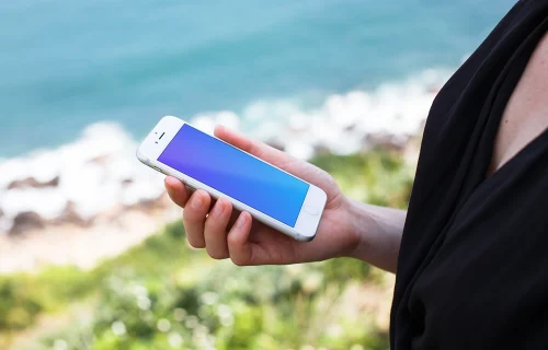 iPhone 7 Silver mockup with ocean in the background