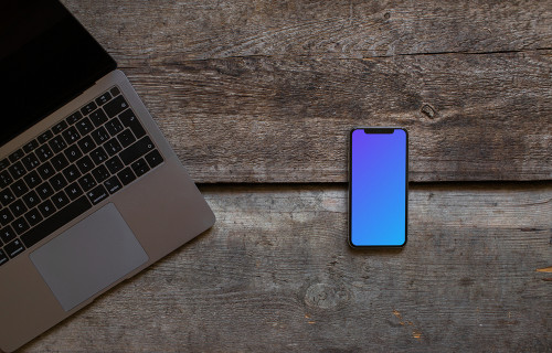 iPhone XS mockup and cropped Macbook Air on the wooden table