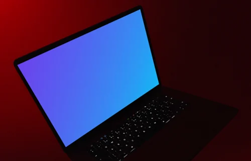 MacBook night mockup held under red light