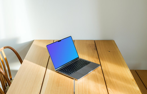 MacBook Pro mockup on a dining table against a white background