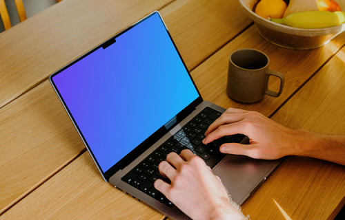 MacBook Pro mockup with a user typing on it.