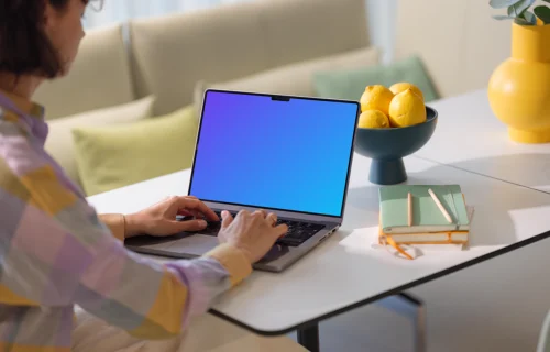 MacBook Pro mockup with woman at a modern home office