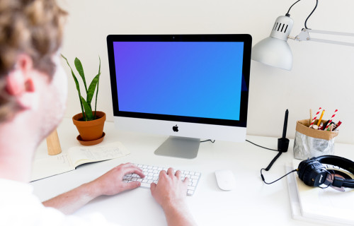 Man working on iMac mockup