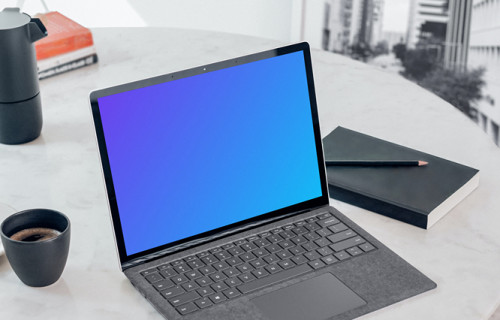 Microsoft Surface Laptop mockup on the white table