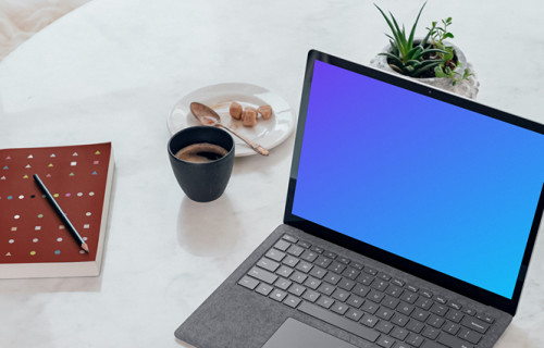 Microsoft Surface Laptop mockup on the marble table