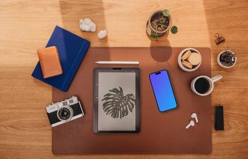 Mockup of phone next to the coffee and tablet