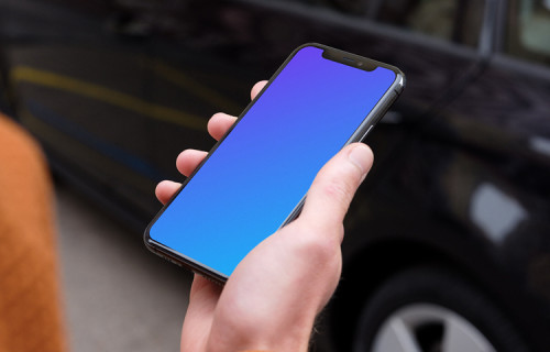 Passenger walking towards a car holding an iPhone 11 mockup