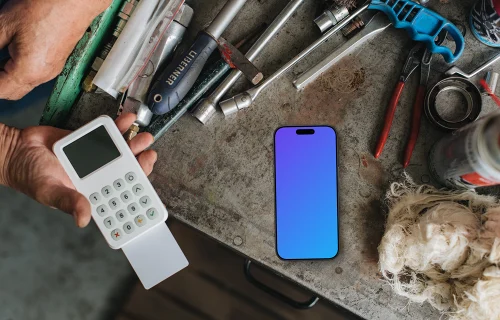 Payment terminal with an iPhone mockup in the workshop