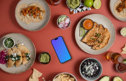 Phone mockup surrounded by Mexican food