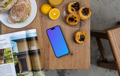 Smartphone mockup dans un café avec des pâtisseries