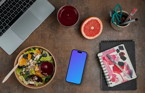 Smartphone mockup next to the delicious salad