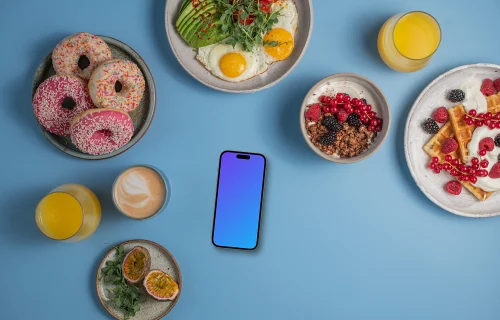 Smartphone mockup surrounded by breakfast meals