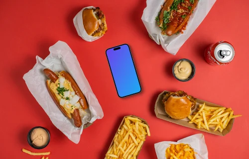 Smartphone mockup rodeado de comida rápida