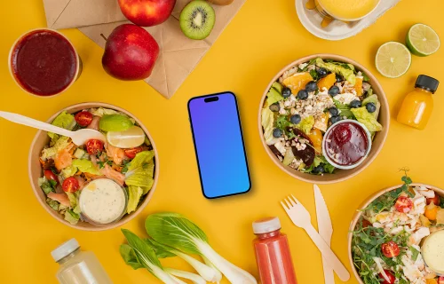 Smartphone mockup entouré de salades saines