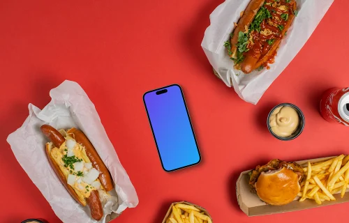 Smartphone mockup entouré de hot-dogs