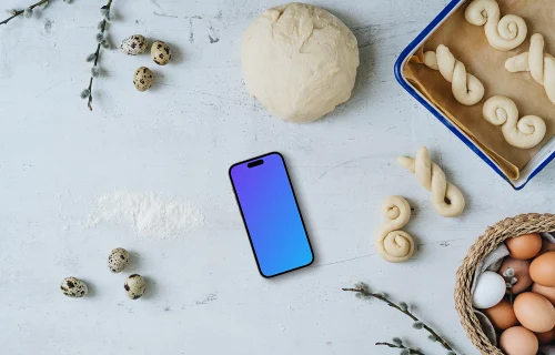 Smartphone mockup with Easter pastries being made