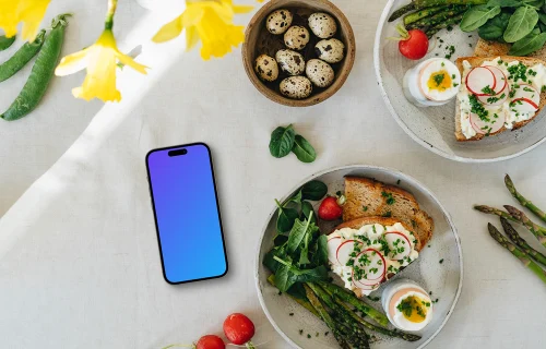 Smartphone mockup with Easter snack and yellow flowers